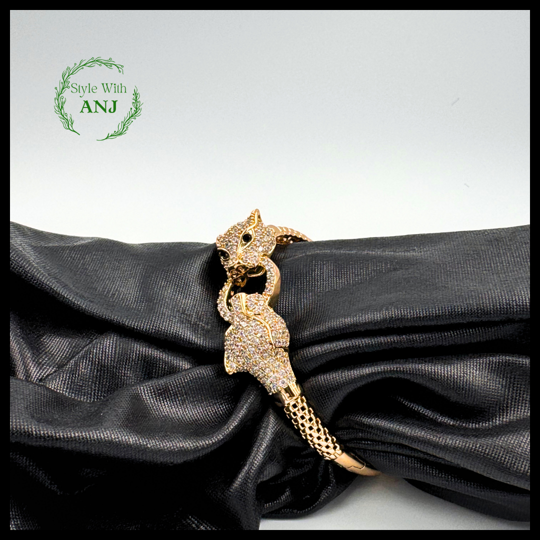 Wild Elegance: Crystal Leopard Head Gold Tone Bangle Bracelet